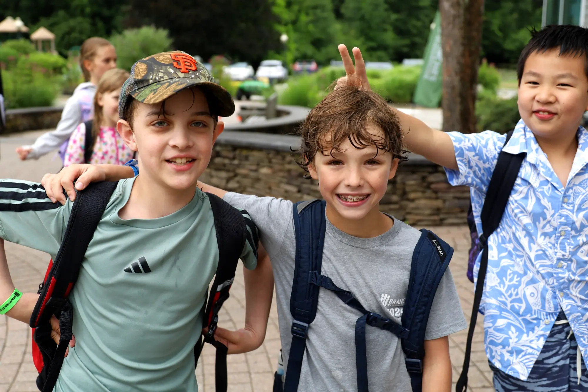Adventurers arriving together with their backpacks