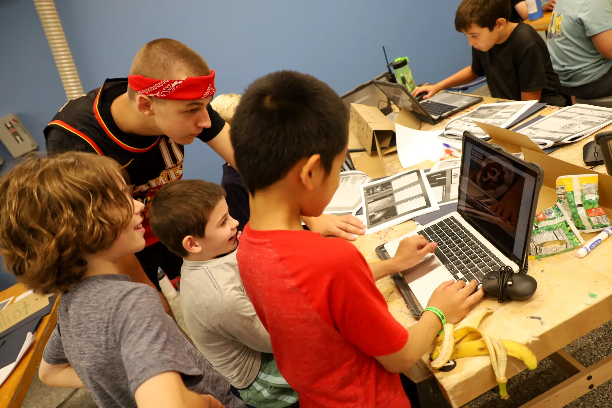 Explorers collaborating on a technology project