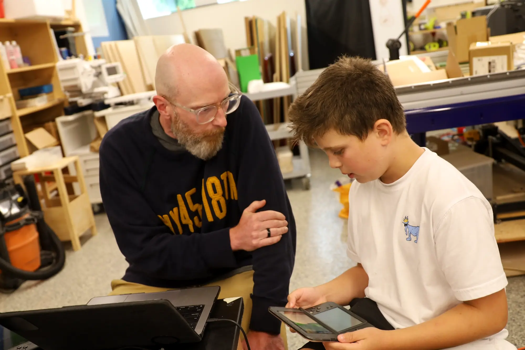 An Explorer receiving guidance during a maker project