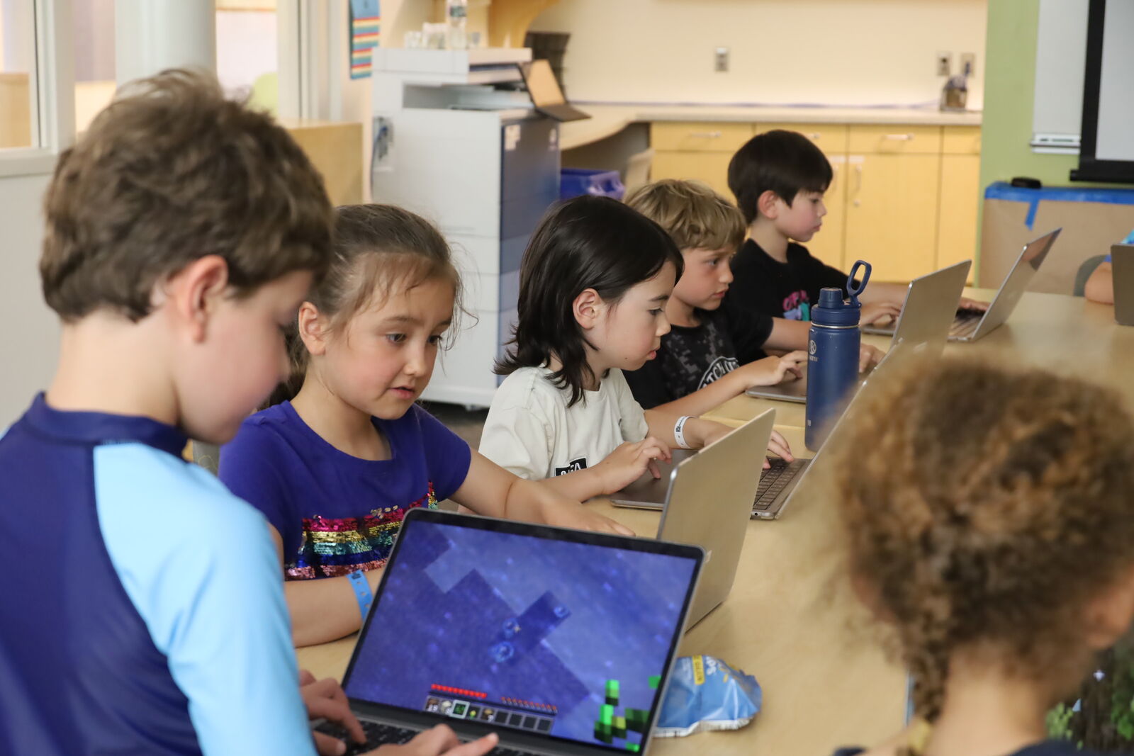 Campers collaborating on a hands-on creative project